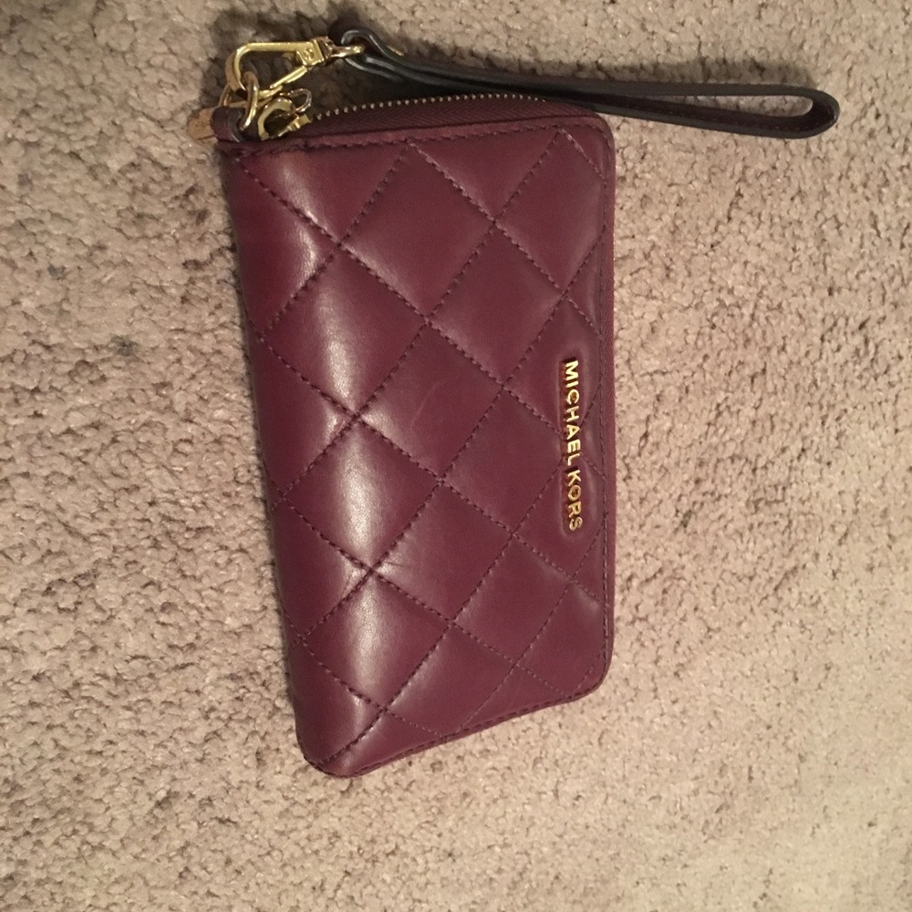 MK maroon wristlet.